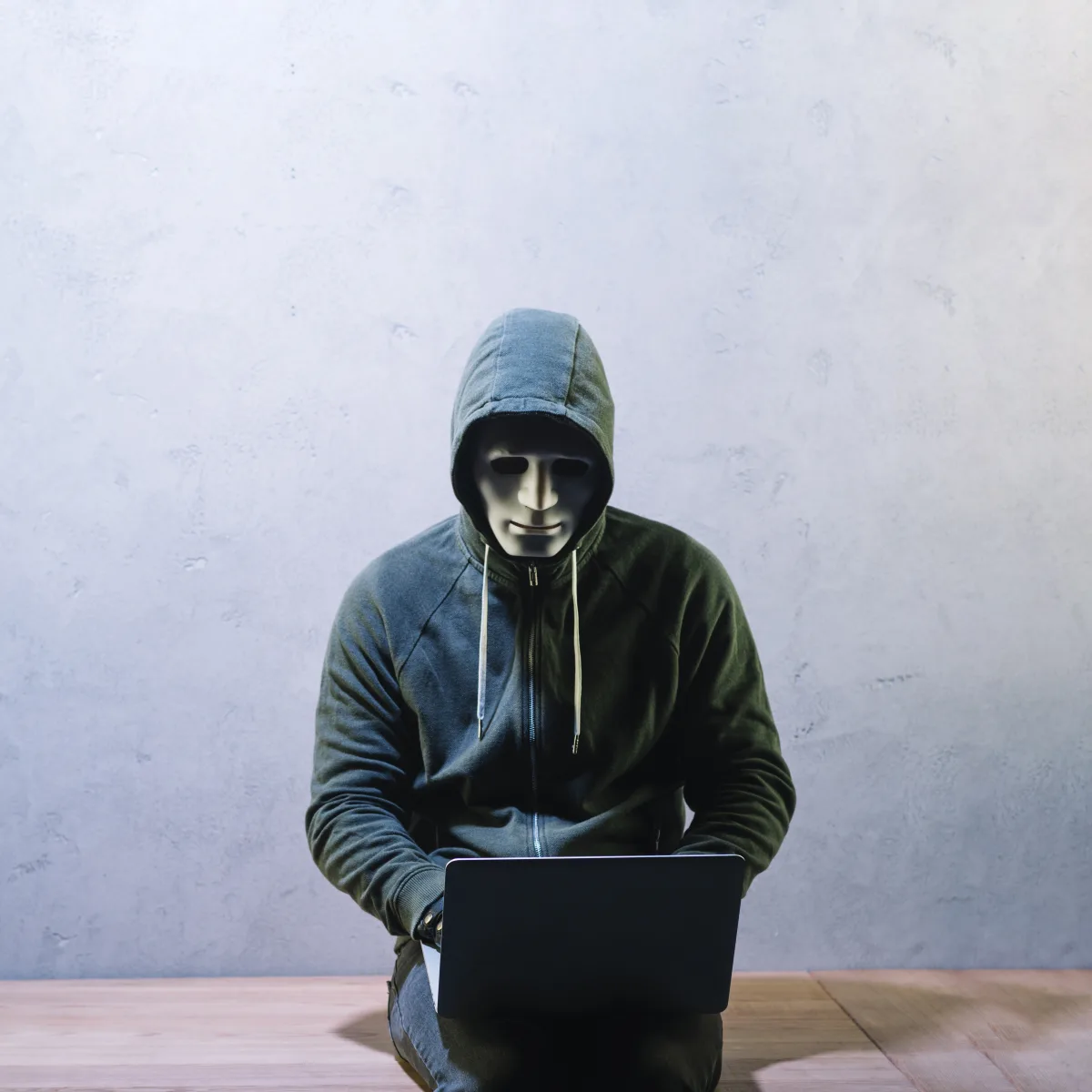 Hacker with laptop - cybersecurity threat illustration